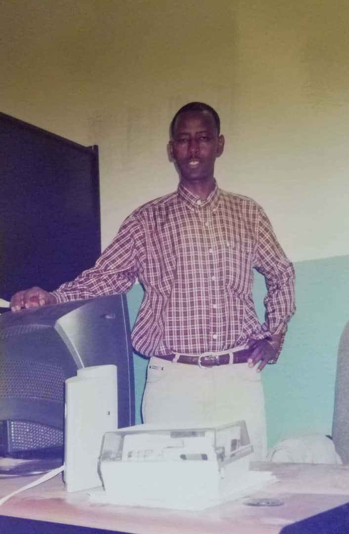 Professor Meareg Amare demonstrating laboratory instruments during a teacher-training program in the 1990s.