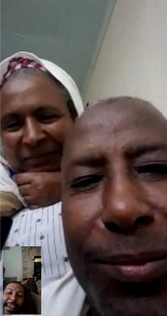 Professor Meareg Amare and his wife on a FaceTime call with their son.
