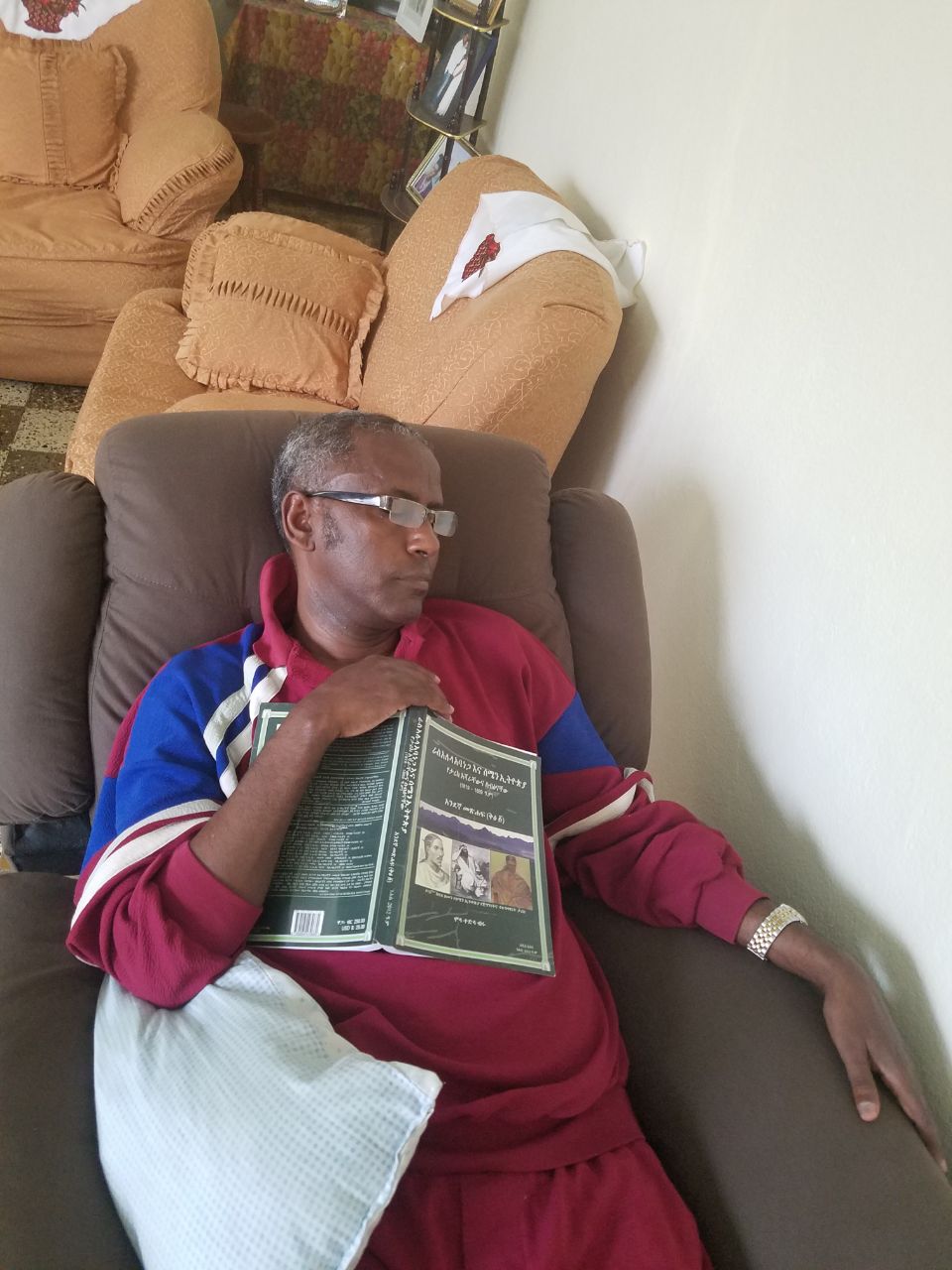 Professor Meareg Amare relaxing in a rocking sofa gifted by his children, 2021.