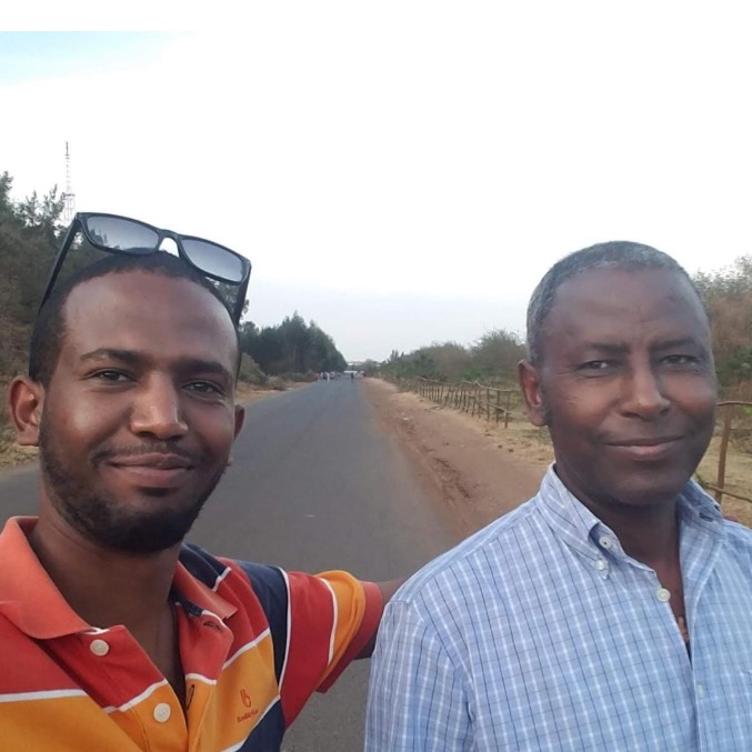 Professor Meareg Amare with one of his sons during a long work trip.
